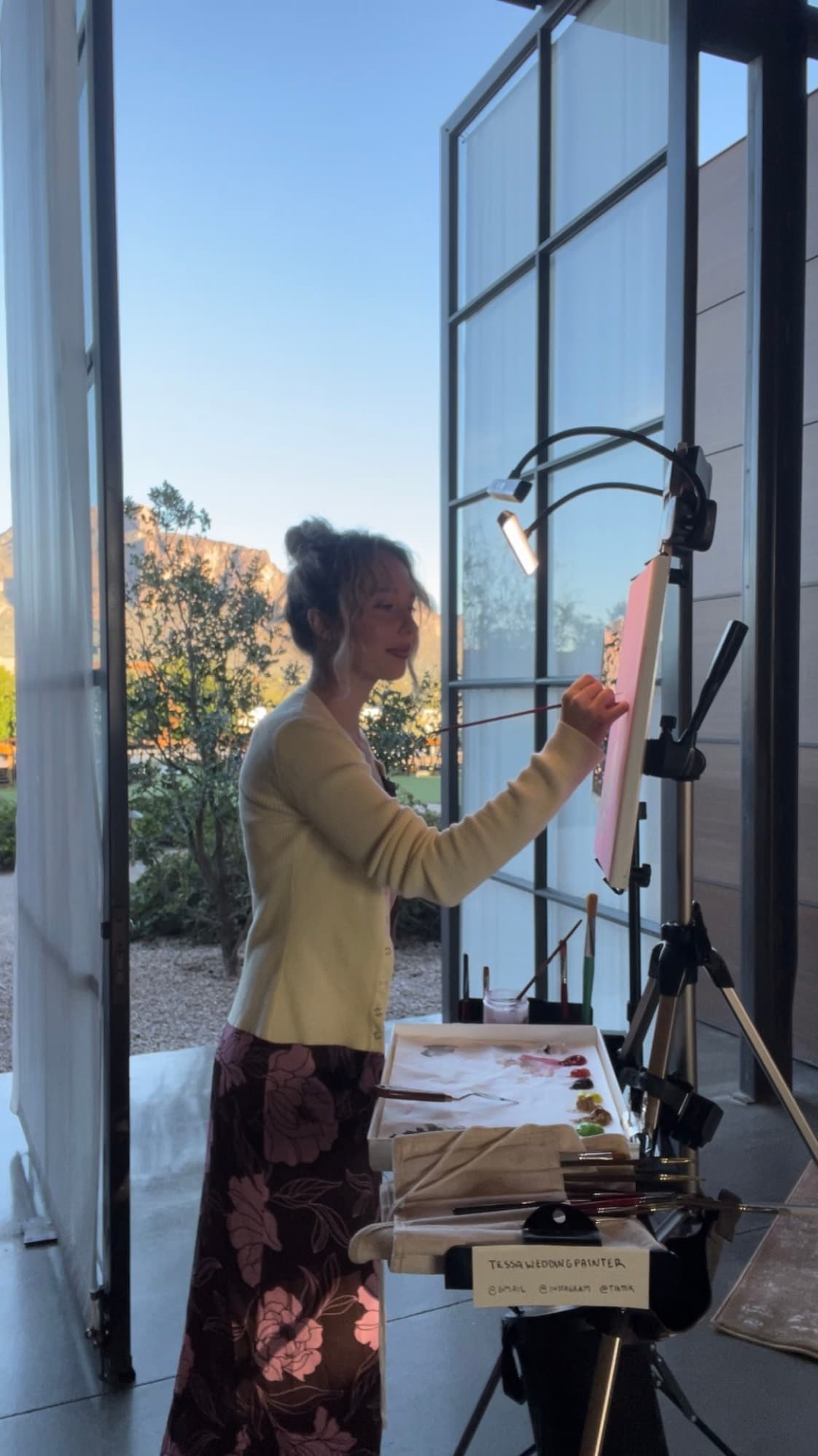 Tessa painting during a wedding reception